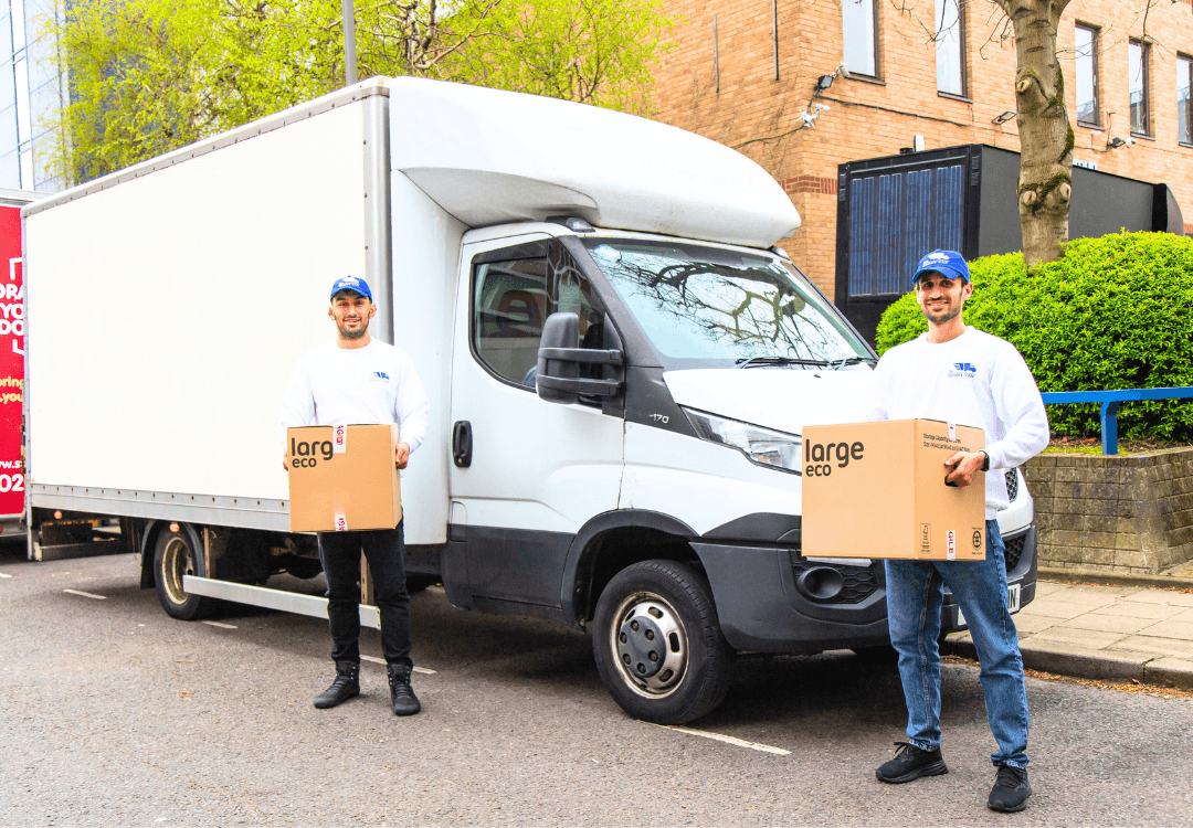 GoodyVan crew standing beside a moving van on a London street